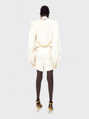 VESTE SANS COL À ÉPAULES CARRÉES
